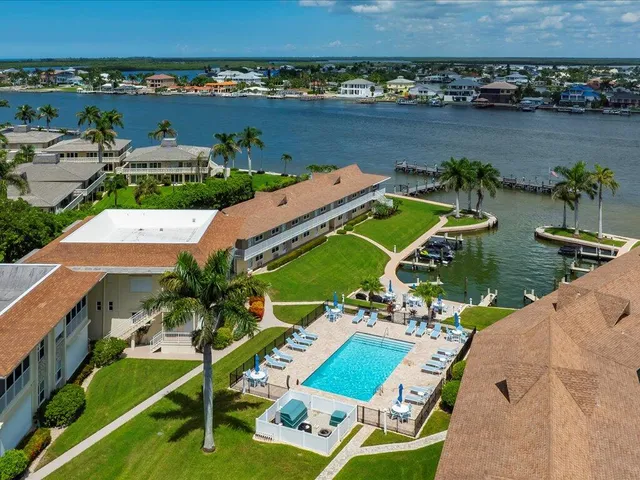 an aerial view of a house with a ocean view
