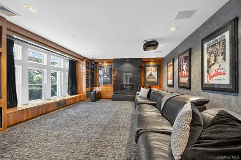 a living room with furniture and large windows