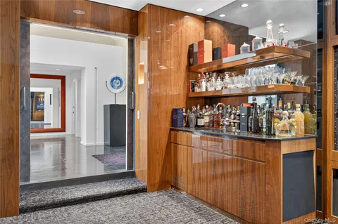 a kitchen with stainless steel appliances granite countertop a refrigerator and a stove