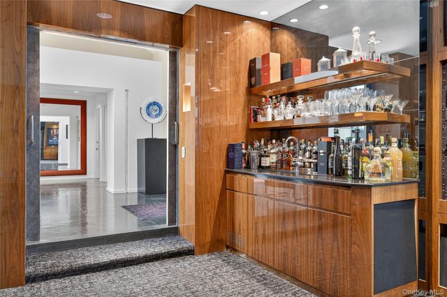 a kitchen with stainless steel appliances granite countertop a refrigerator and a stove