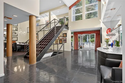 a view of entryway and hall with dining room