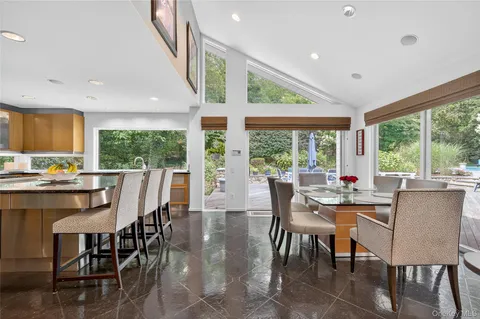 a kitchen with stainless steel appliances granite countertop a stove and a sink