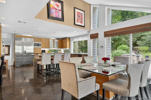 a view of a dining room with furniture window and outside view