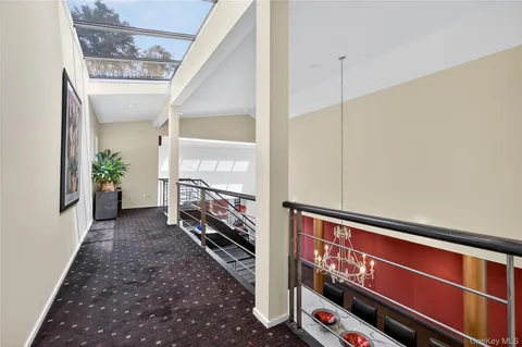 a kitchen with stainless steel appliances granite countertop table chairs sink and cabinets
