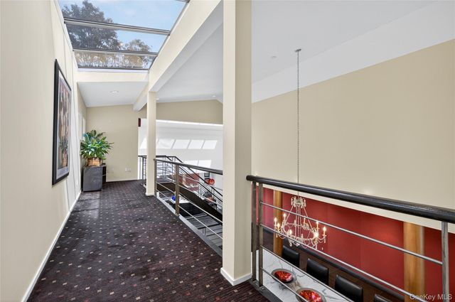 a kitchen with stainless steel appliances granite countertop table chairs sink and cabinets