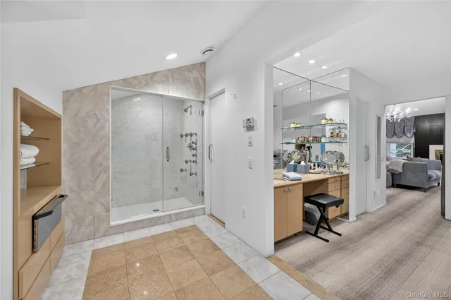 a white bath tub sitting in a bathroom next to a window