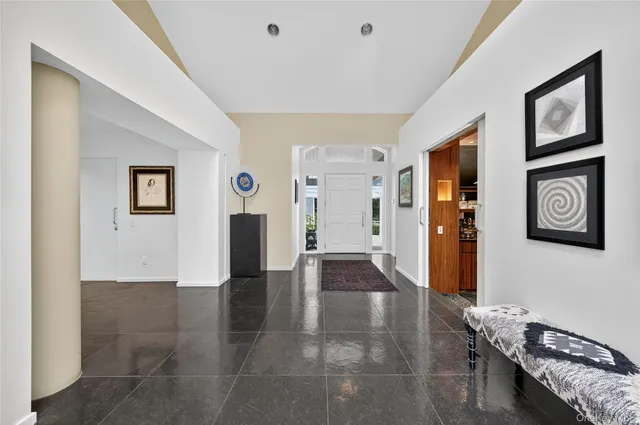 a bathroom with a shower sink and mirror