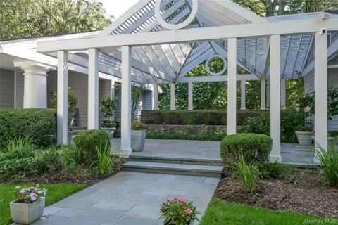 a view of a house with a garden and plants