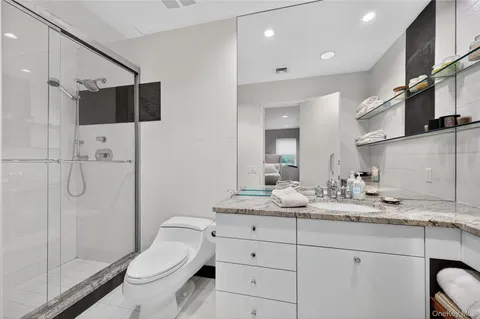 a bedroom with furniture and a wooden floor