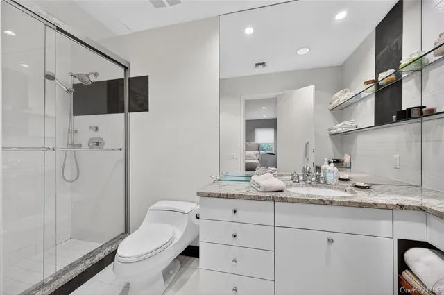 a bedroom with furniture and a wooden floor