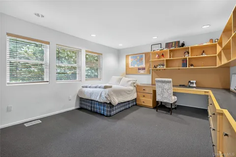 a bathroom with a double vanity sink toilet mirror and shower