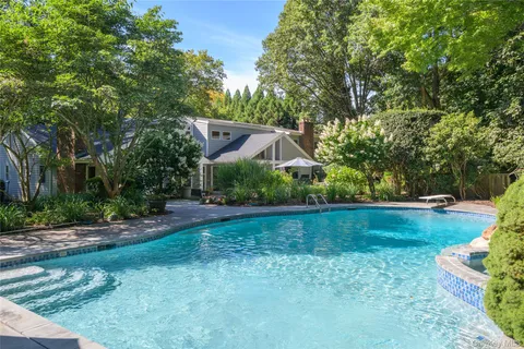 a view of a table and chairs under an umbrella