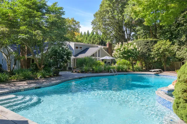 a view of a table and chairs under an umbrella
