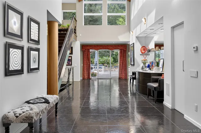 a view of a entryway with furniture and floor to ceiling window
