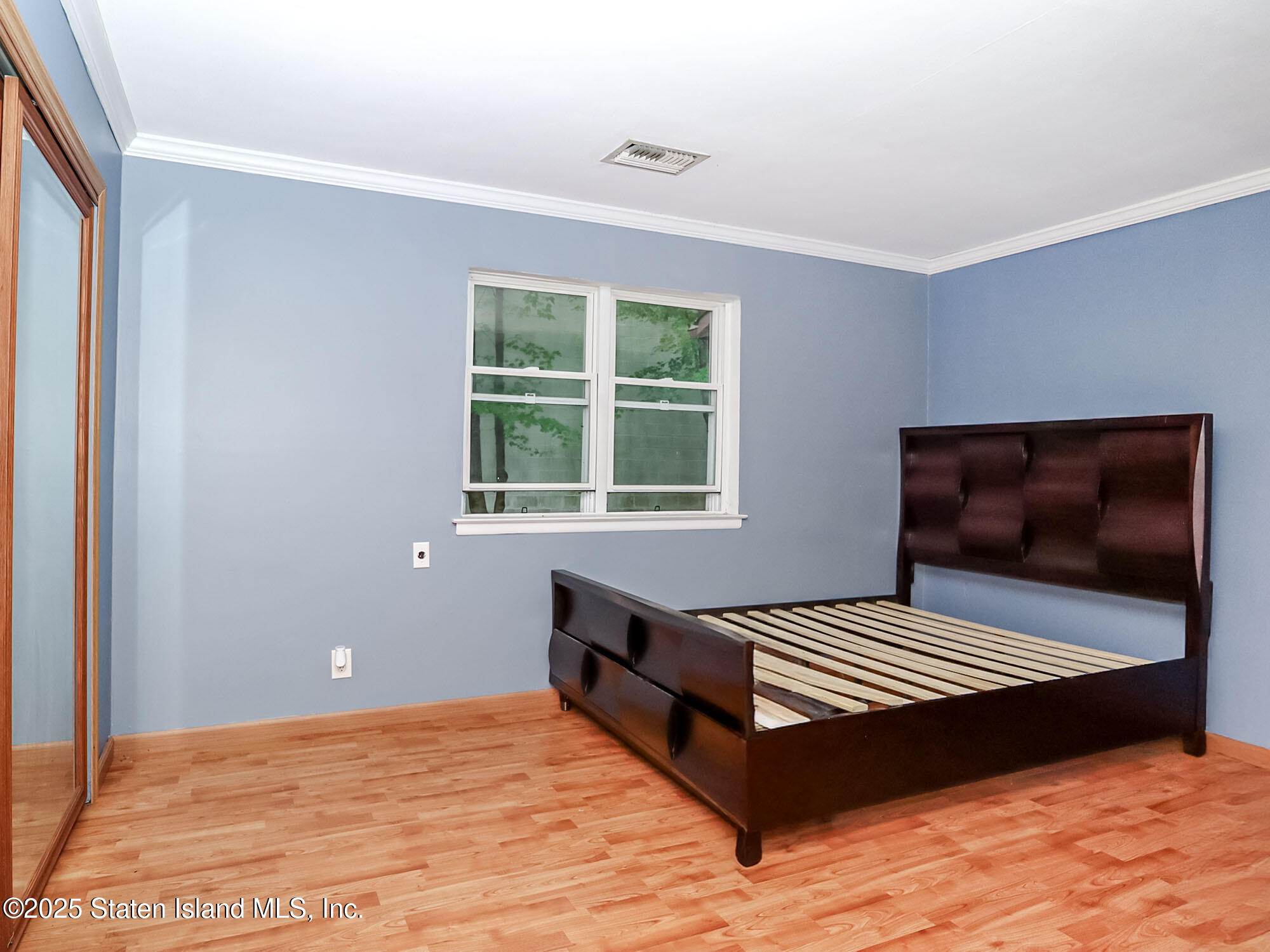 264 Timber Ridge Drive Staten Island, NY 10306 - Photo 12 of 31 a bedroom with a bed and a window