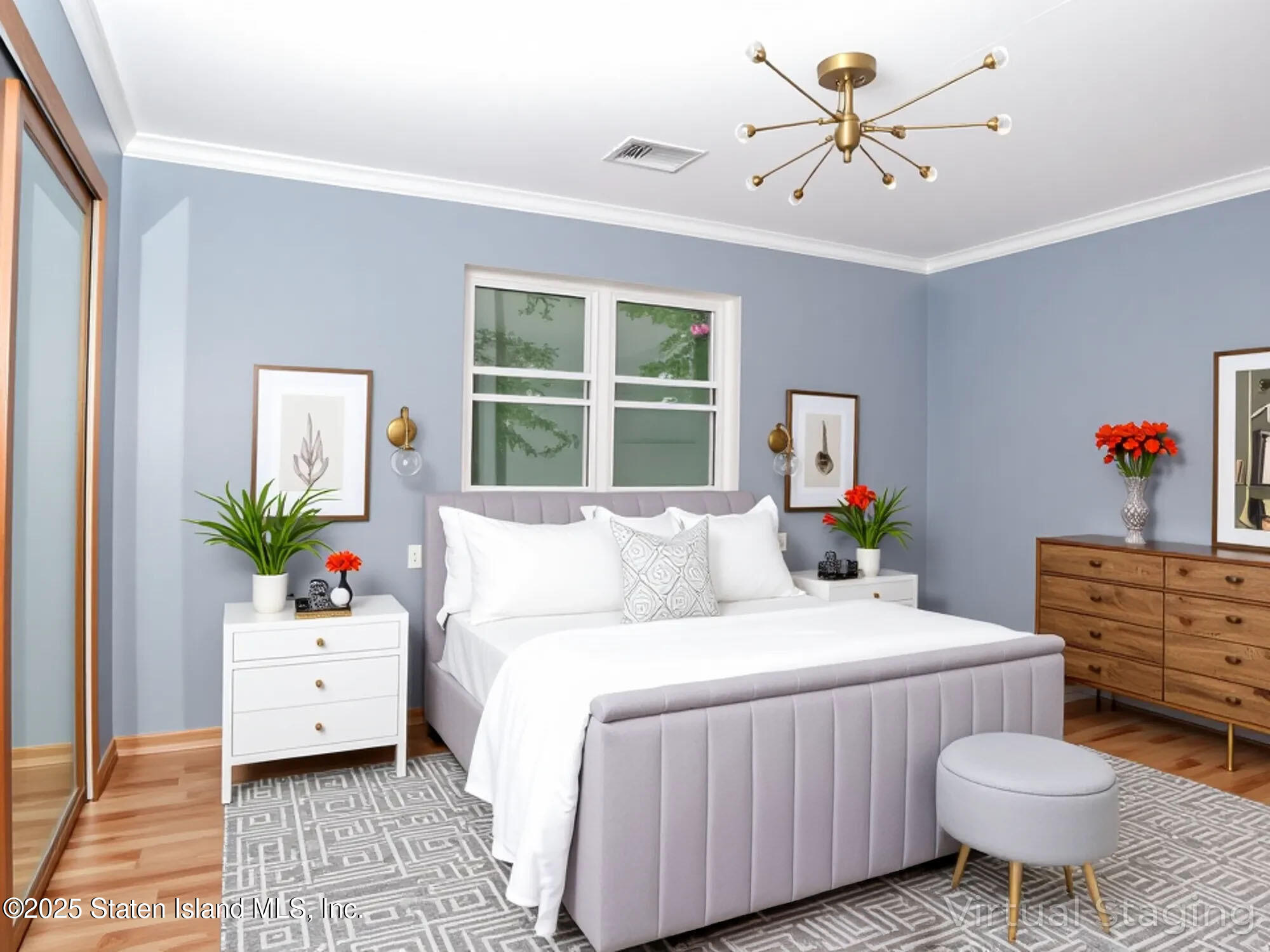 264 Timber Ridge Drive Staten Island, NY 10306 - Photo 13 of 31 a bedroom with a bed and a chandelier