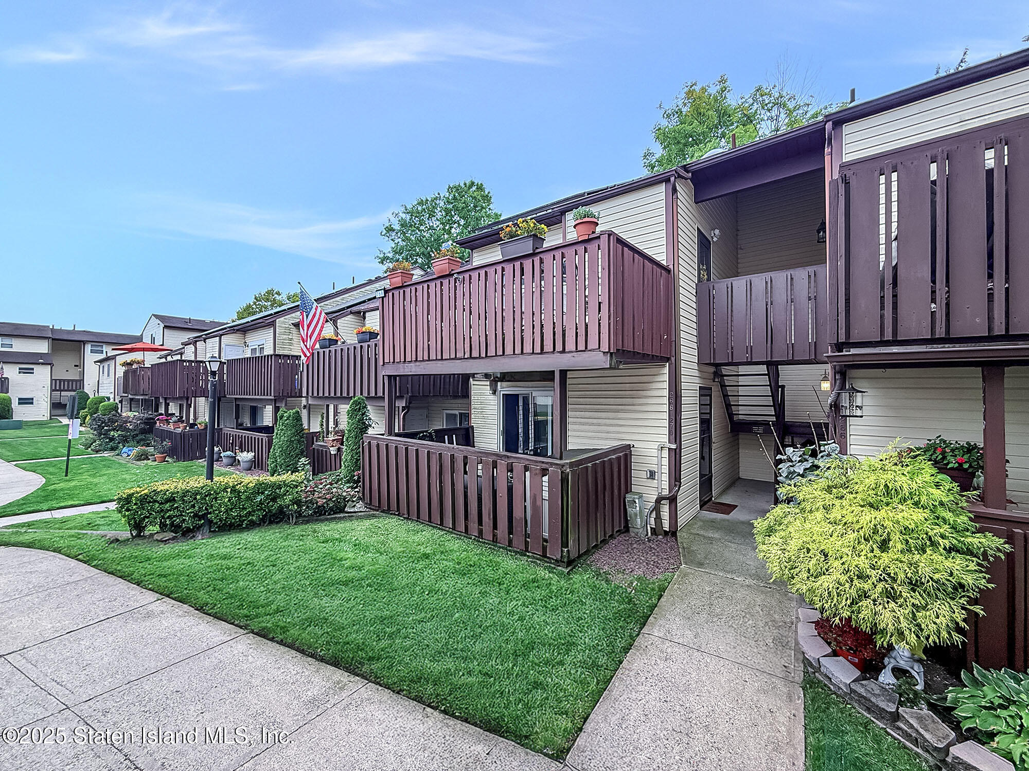 264 Timber Ridge Drive Staten Island, NY 10306 - Photo 2 of 31 a front view of a house with garden