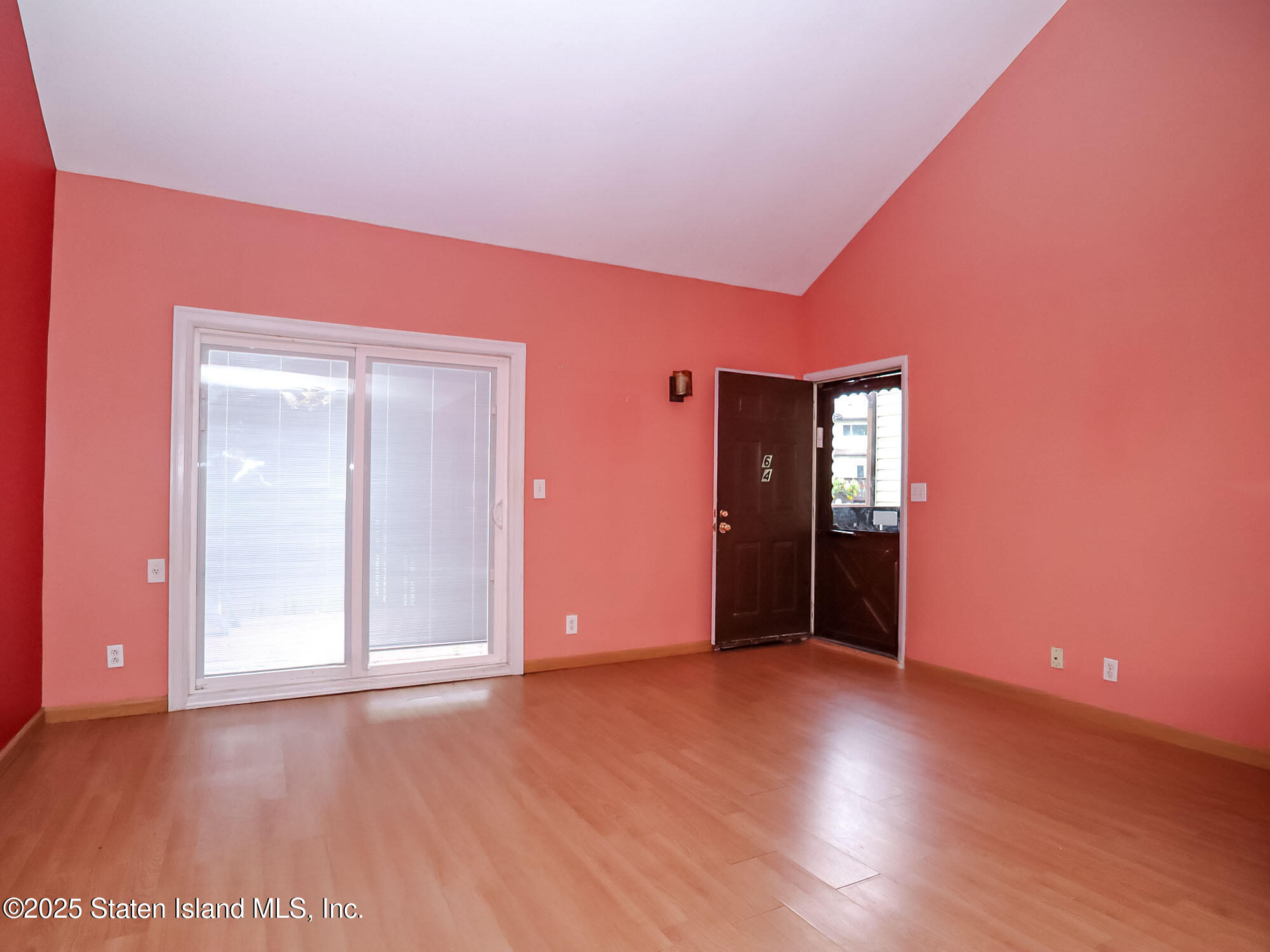 264 Timber Ridge Drive Staten Island, NY 10306 - Photo 4 of 31 a view of an empty room with wooden floor and closet