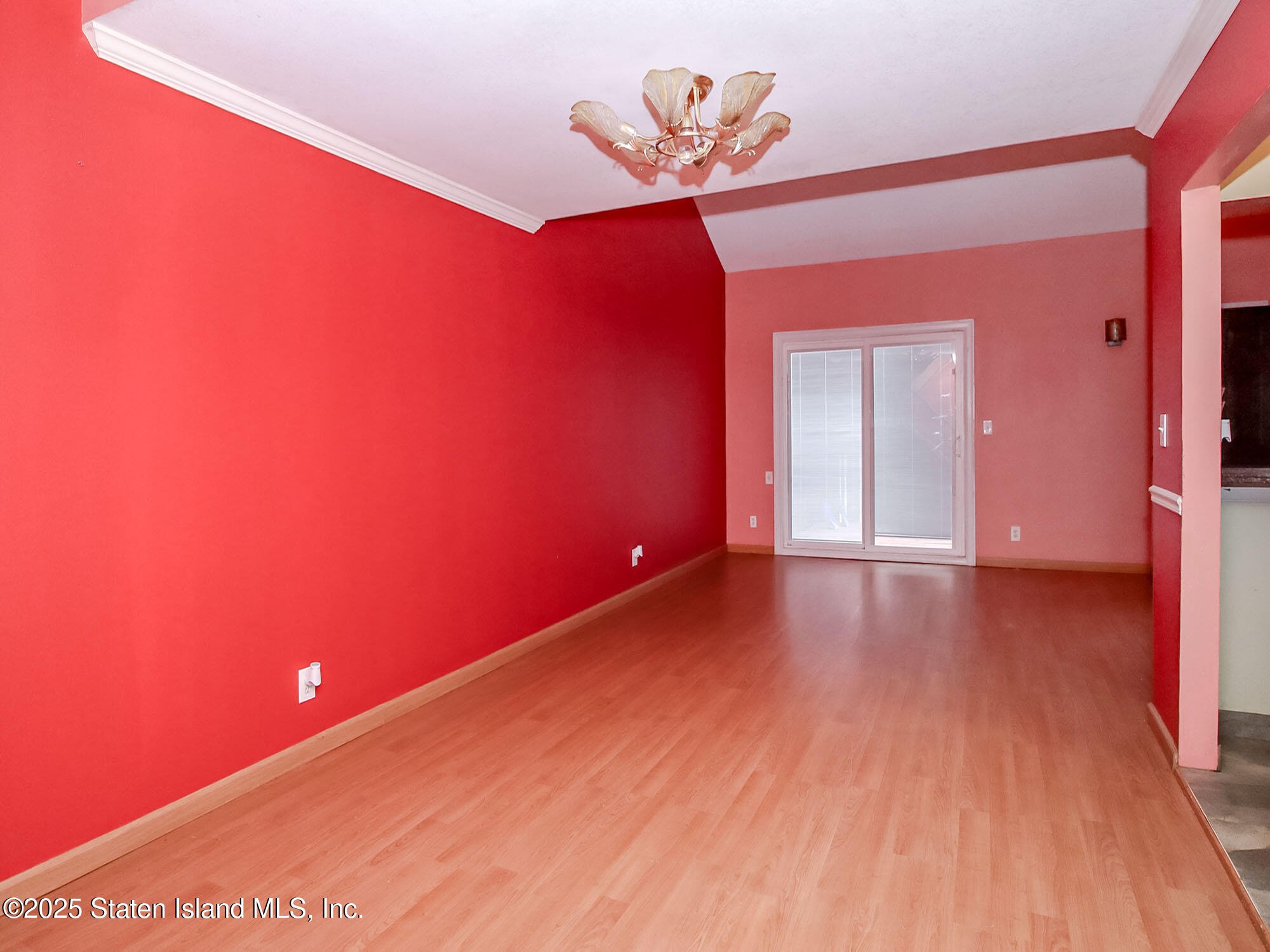 264 Timber Ridge Drive Staten Island, NY 10306 - Photo 9 of 31 a view of an empty room with wooden floor