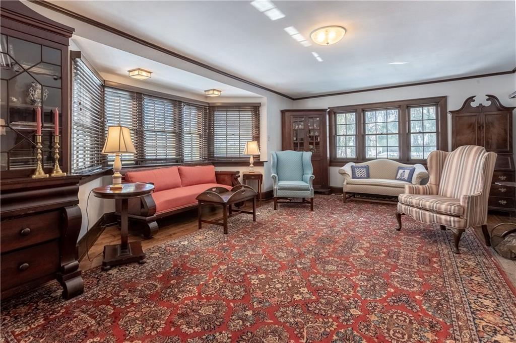 323 Sycamore Road Sewickley, PA 15143 - Photo 2 of 22 Spacious living room that is flooded with light from all the beautiful windows.