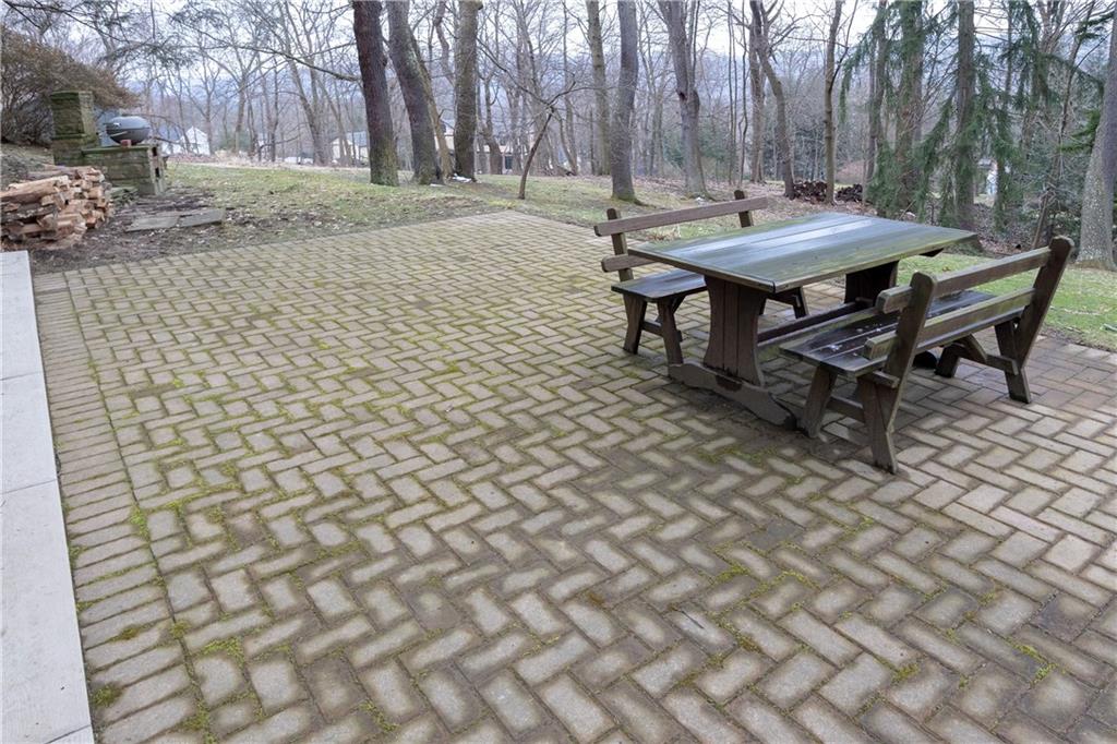 323 Sycamore Road Sewickley, PA 15143 - Photo 20 of 22 Back patio with nice wooded views.