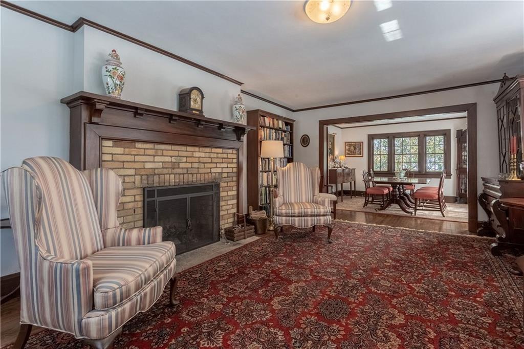 323 Sycamore Road Sewickley, PA 15143 - Photo 3 of 22 The living room has an Arts & Crafts inspired feeling. It is open to the dining room.