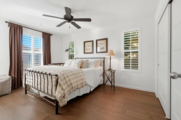 a bed room with a bed and a window
