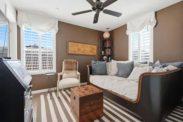 a living room with furniture and windows