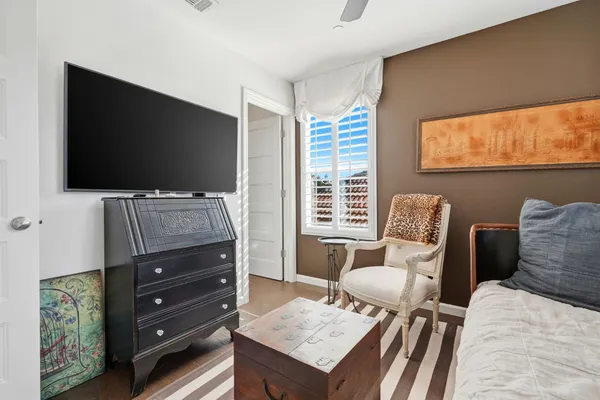 a bedroom with a bed and furniture