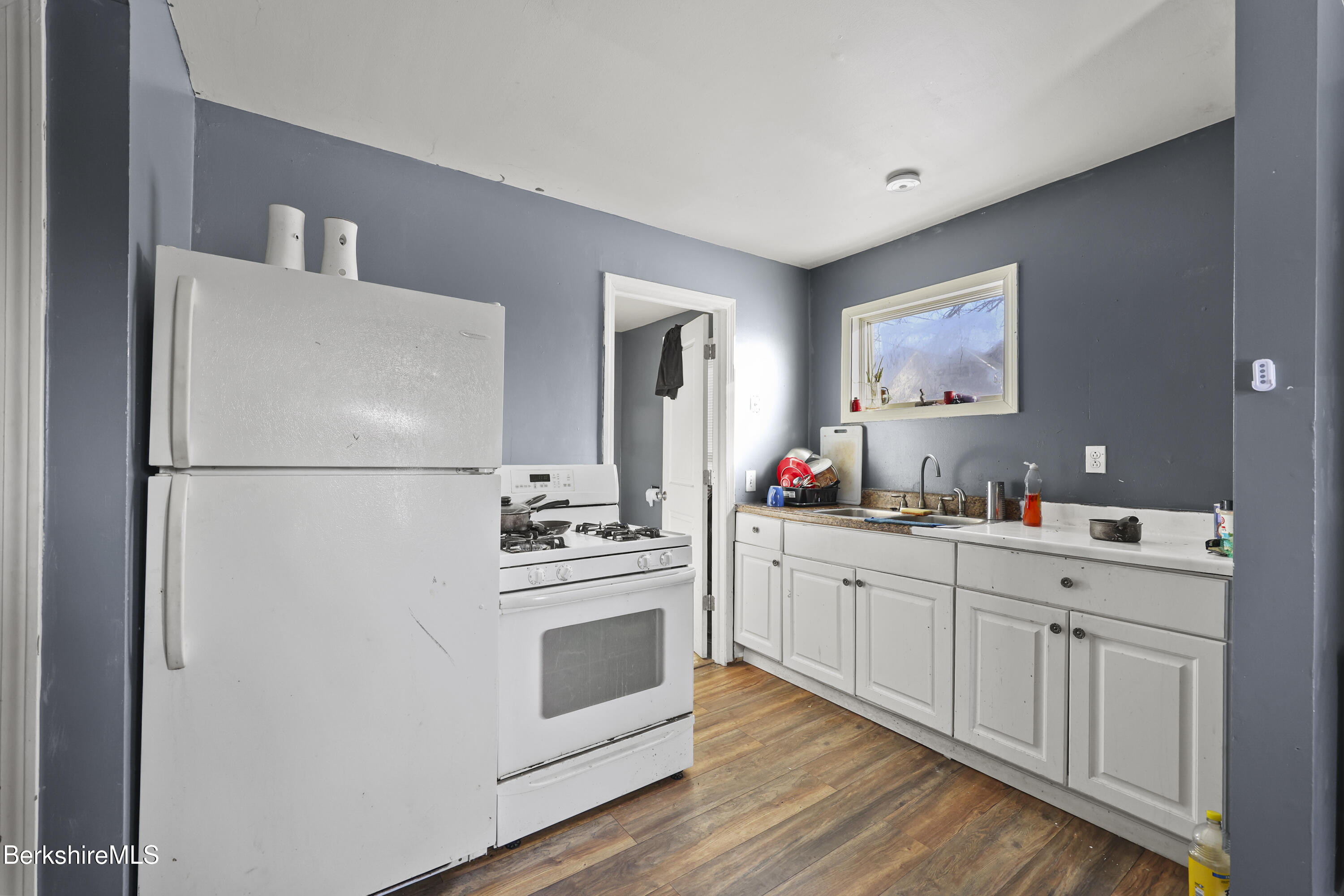 1 1/2 Cherry Street Pittsfield, MA 01201 - Photo 6 of 23 a kitchen with white cabinets and white appliances