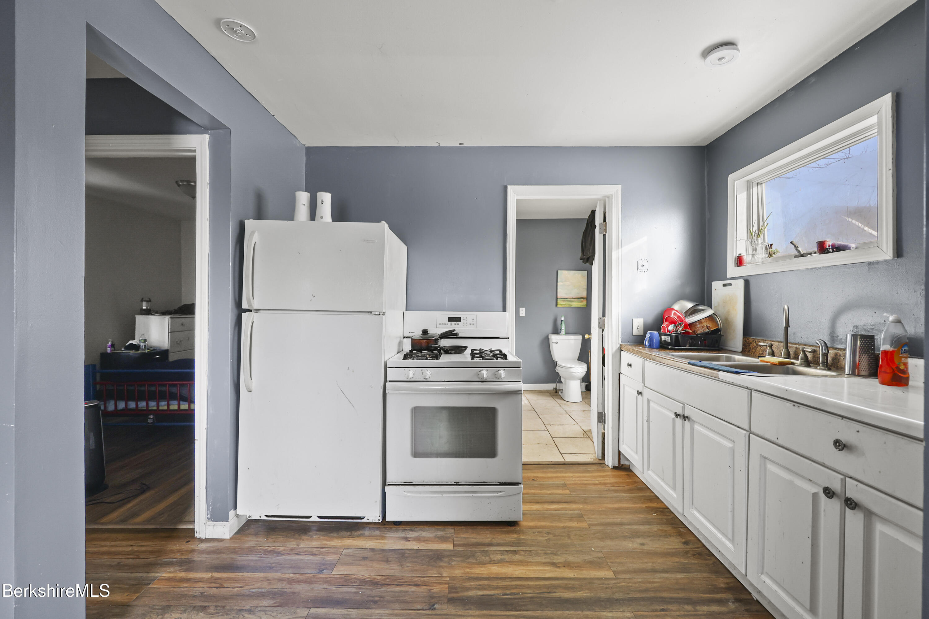 1 1/2 Cherry Street Pittsfield, MA 01201 - Photo 7 of 23 a kitchen with a sink cabinets and stainless steel appliances