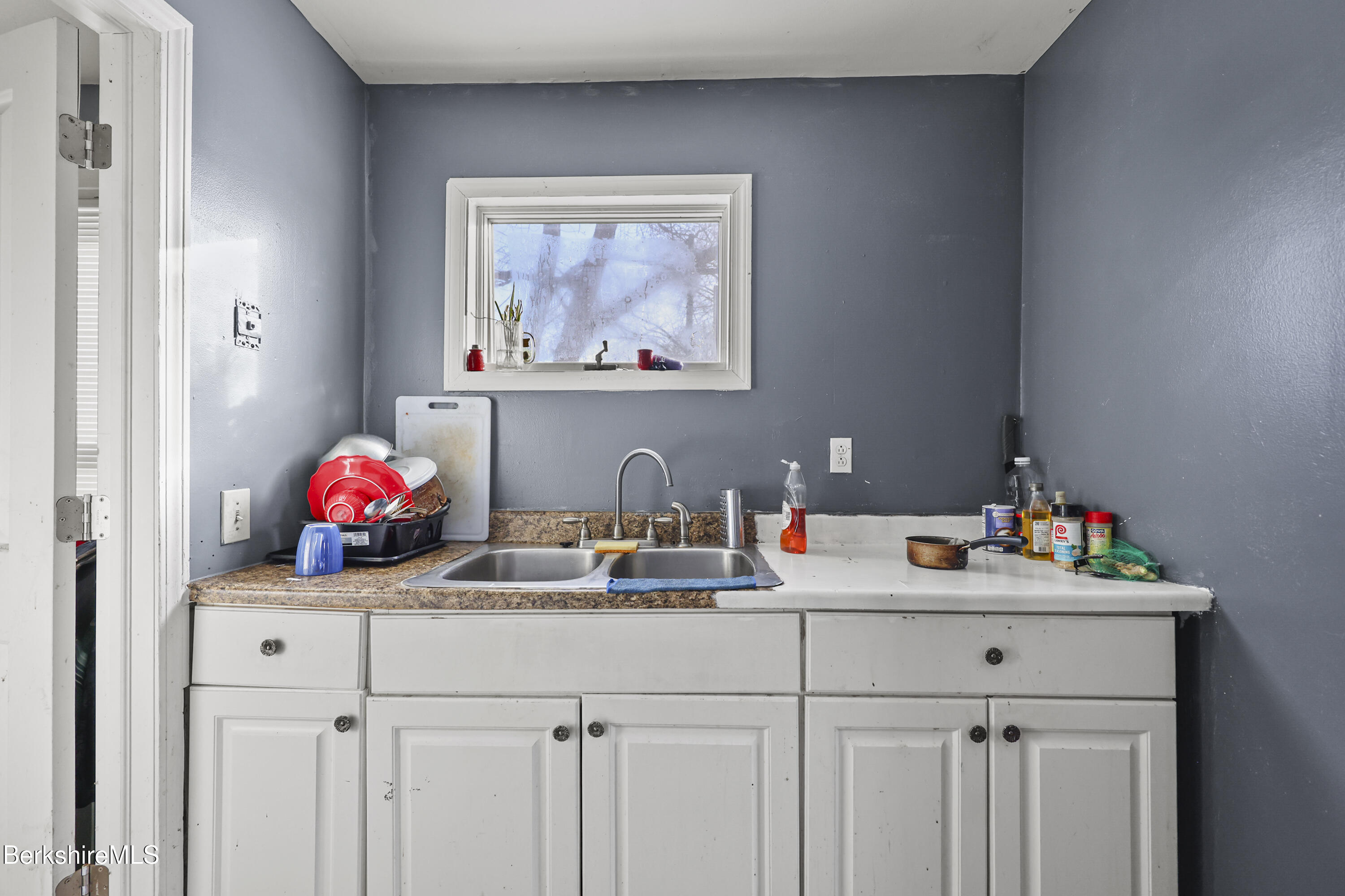 1 1/2 Cherry Street Pittsfield, MA 01201 - Photo 8 of 23 a bathroom with a sink mirror and vanity