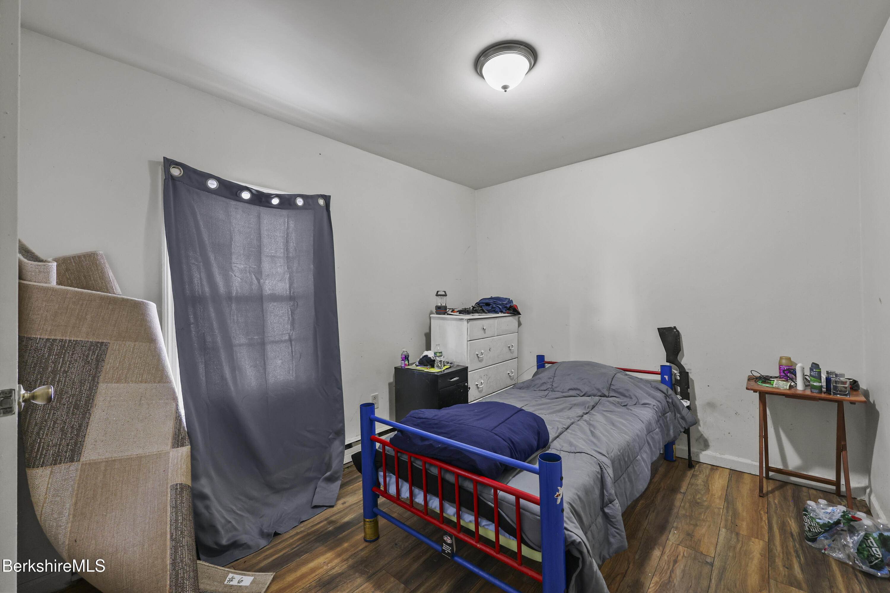 1 1/2 Cherry Street Pittsfield, MA 01201 - Photo 9 of 23 a bedroom with a bed and a mirror