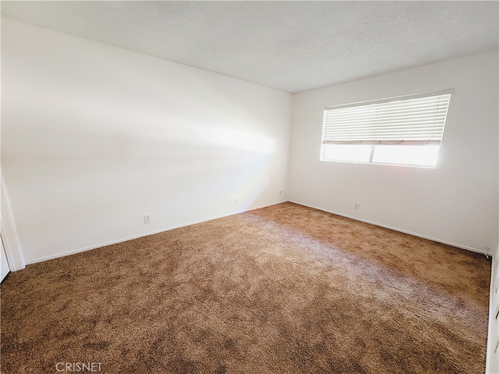 12601 Van Nuys Boulevard, Unit 138 Pacoima, CA 91331 - Photo 12 of 19 an empty room with a window