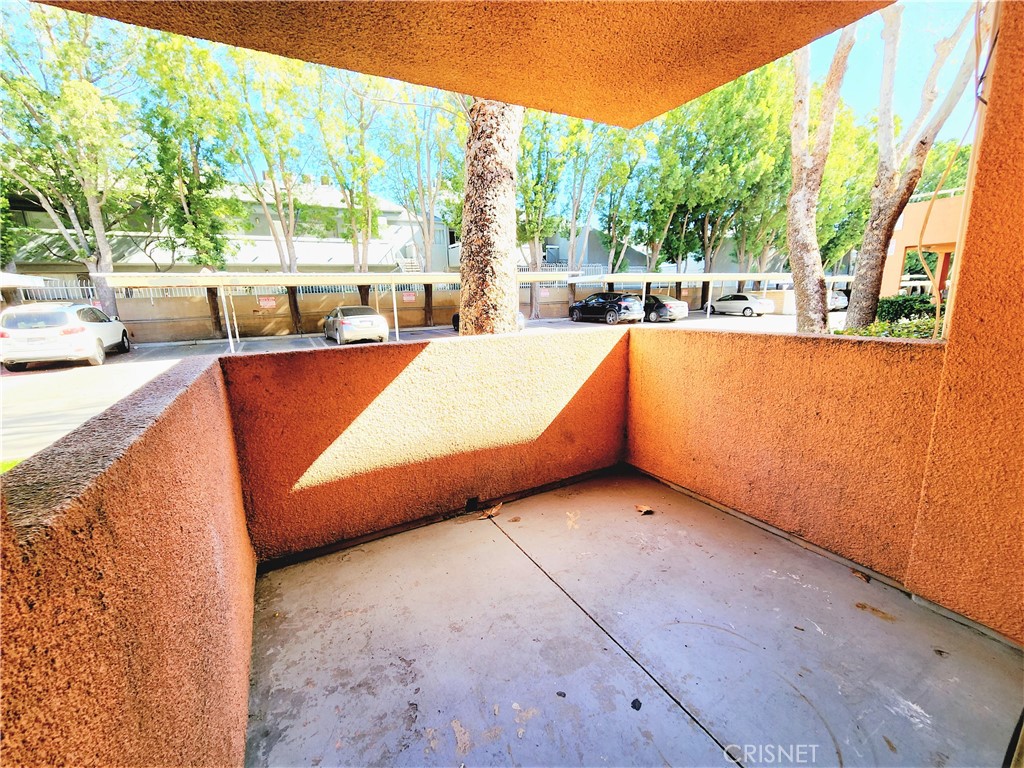 12601 Van Nuys Boulevard, Unit 138 Pacoima, CA 91331 - Photo 15 of 19 a room with trees in front of it