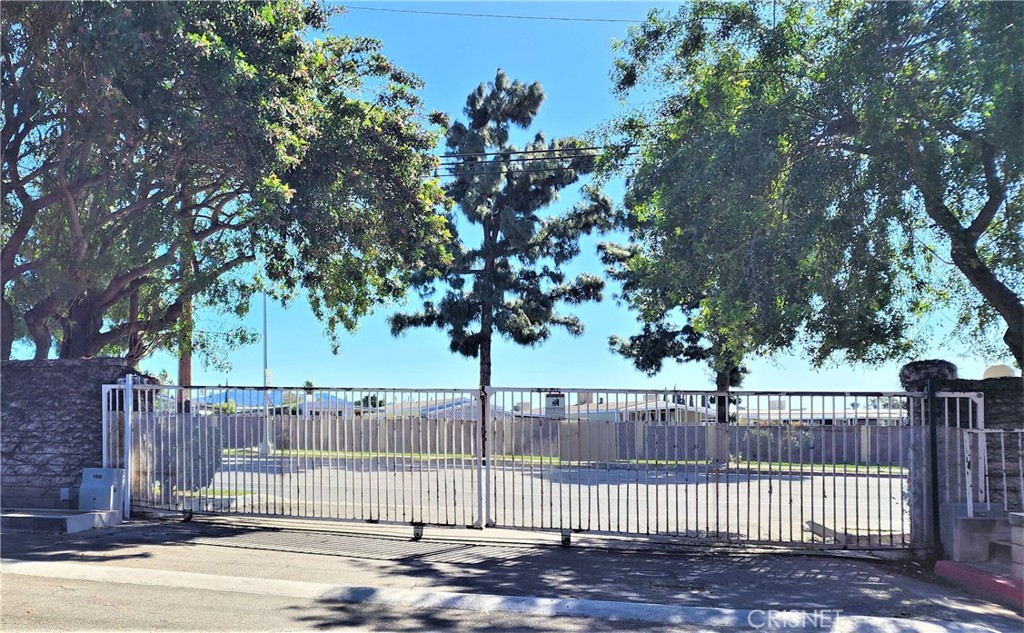 12601 Van Nuys Boulevard, Unit 138 Pacoima, CA 91331 - Photo 19 of 19 a view of a yard with a trees