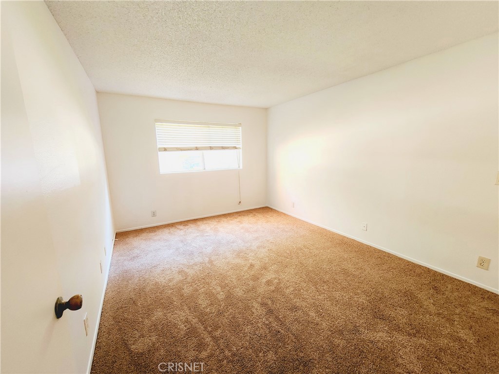 12601 Van Nuys Boulevard, Unit 138 Pacoima, CA 91331 - Photo 9 of 19 an empty room with windows