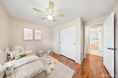 a bedroom with bed and a chandelier