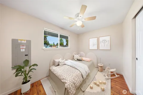 a bedroom with a bed and a chandelier