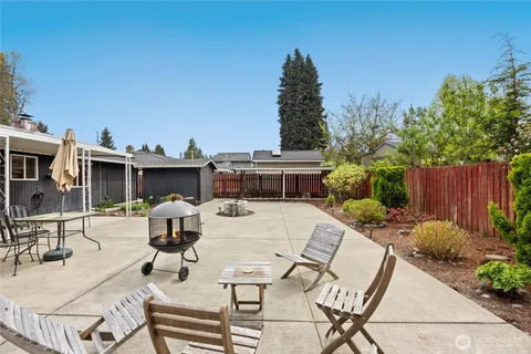 a view of a backyard with furniture
