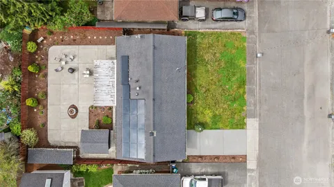 an aerial view of a house with a swimming pool
