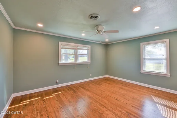 a view of an empty room with a window