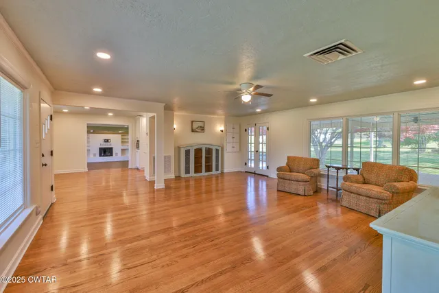 a living room with furniture and a table