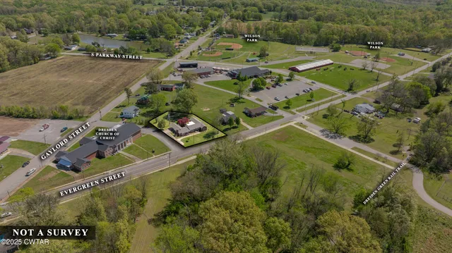 an aerial view of a house with a garden