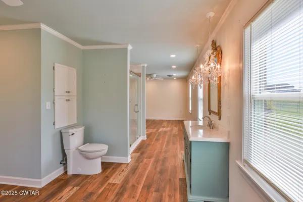 a spacious bathroom with a bathtub shower sink and toilet