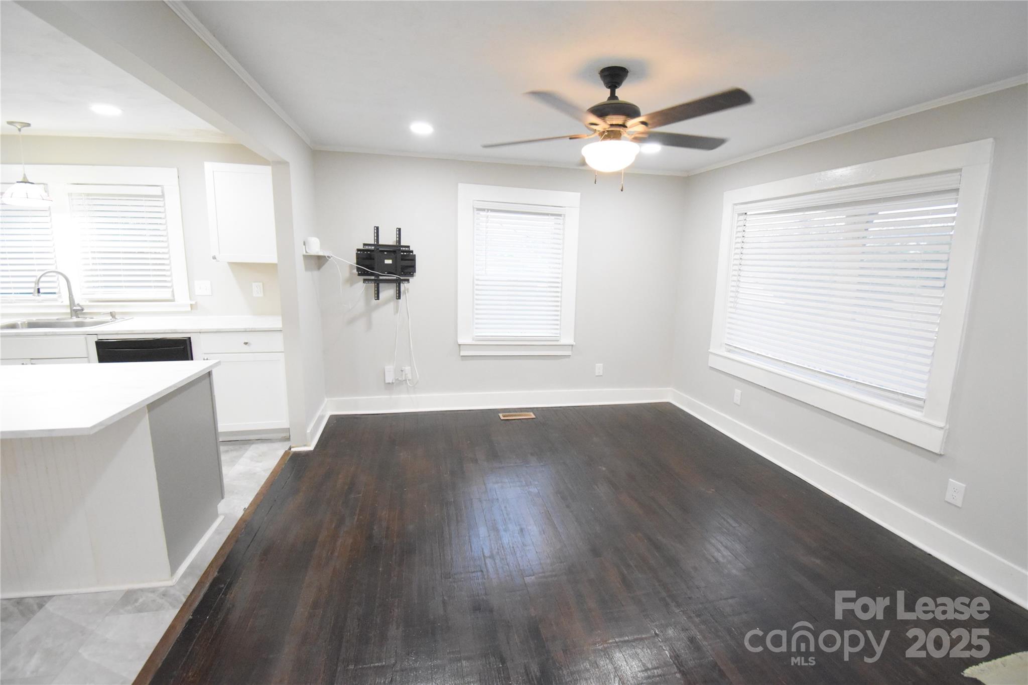 199 Crowell Drive Southwest Concord, NC 28025 - Photo 9 of 19 a view of a kitchen with a sink cabinets and wooden floor