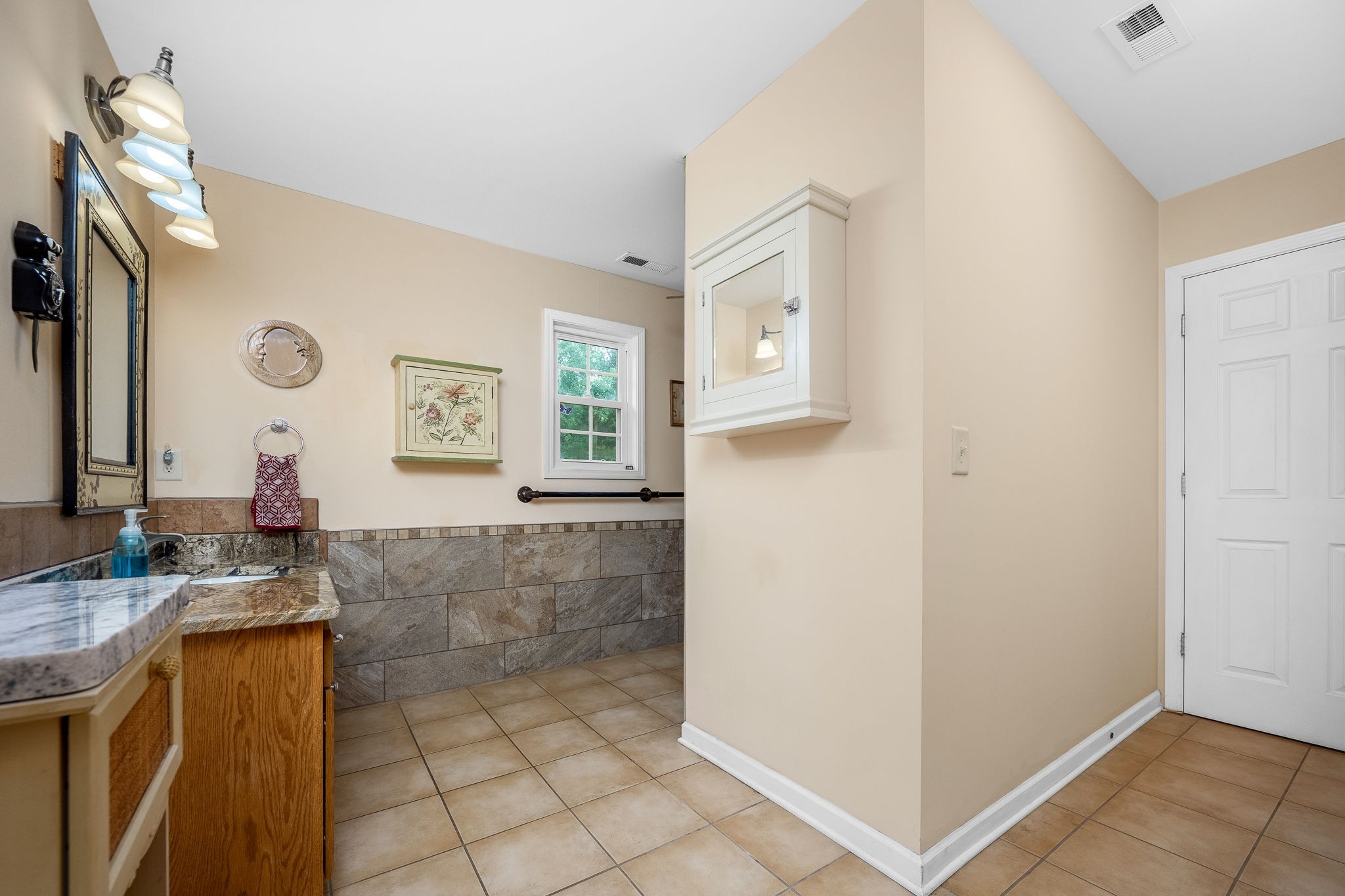 745 Union Ridge Road Wartrace, TN 37183 - Photo 33 of 76 a bathroom with a granite countertop sink a mirror and a shower