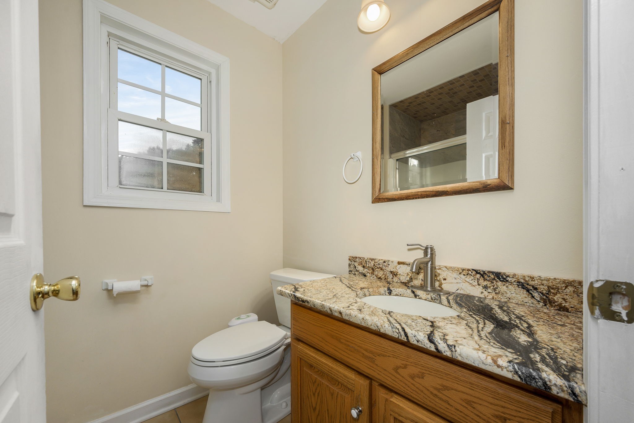 745 Union Ridge Road Wartrace, TN 37183 - Photo 40 of 76 a bathroom with a granite countertop toilet sink and mirror