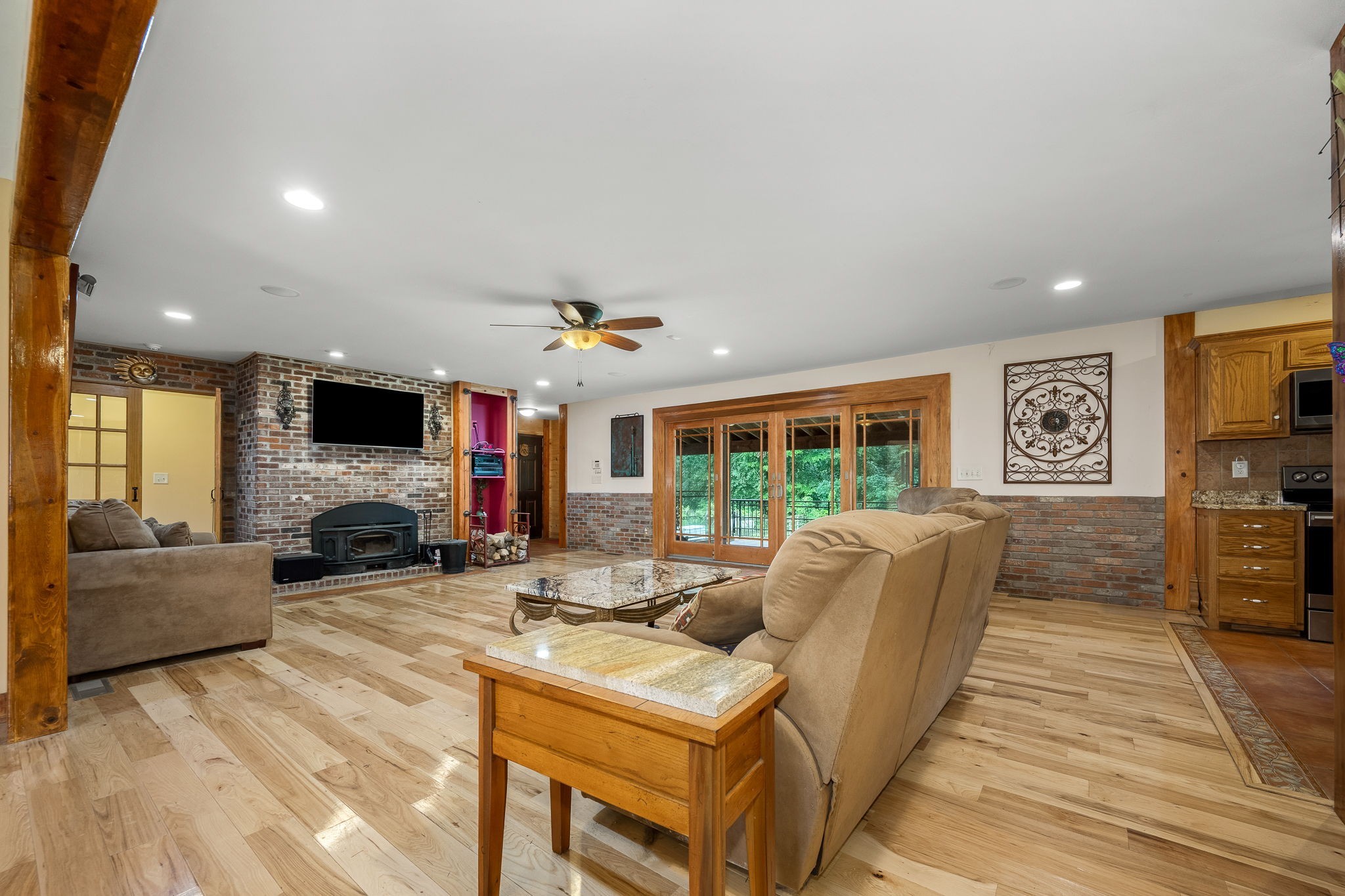 745 Union Ridge Road Wartrace, TN 37183 - Photo 9 of 76 a living room with furniture a flat screen tv and a fireplace