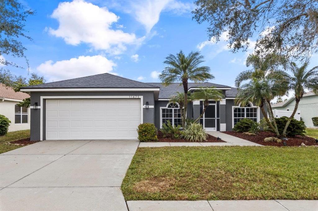 front view of a house with a yard